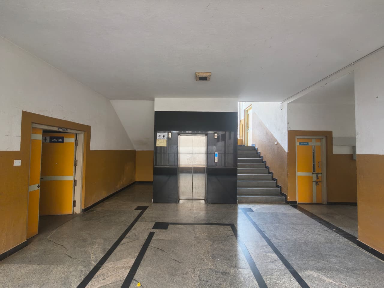 Wheelchair-accessible ramp with handrails